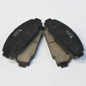 Колодки тормозные дисковые Nisshinbo передние, комплект на ось (4 шт), арт. PF-1212